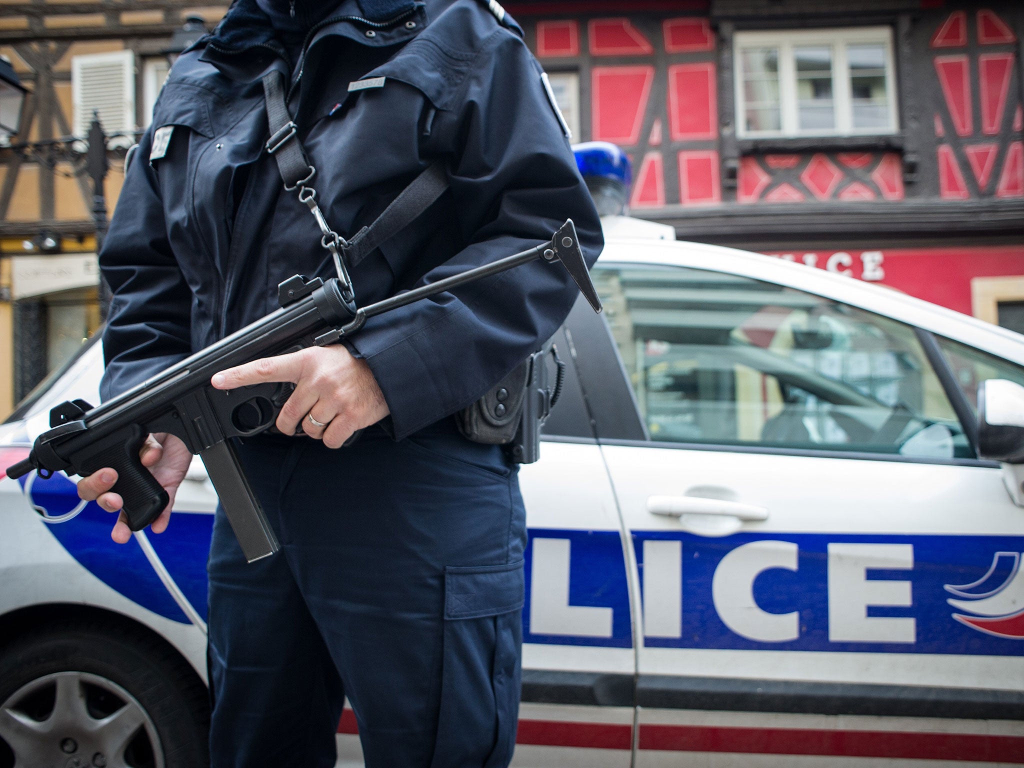 French policeman holds a weapon on 21 November, 2015 as he patrols at the Colmar Christmas market. French lawmakers gave near-unanimous backing on 20 November to a three-month extension of the state of emergency introduced following the Paris attacks
