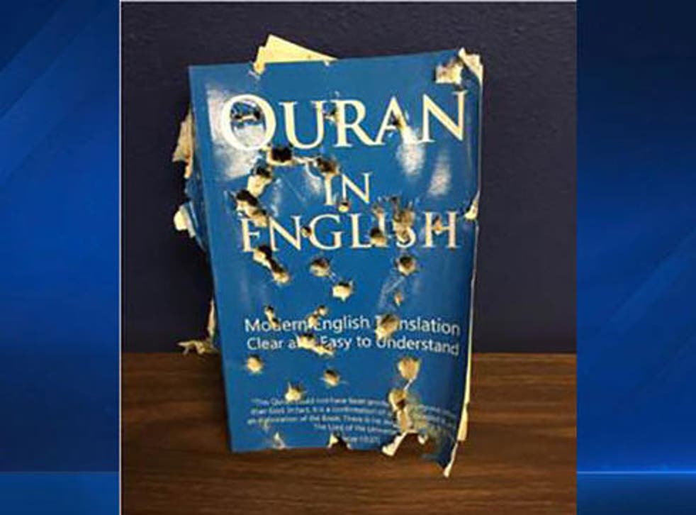 An English translation of the Quran pierced with multiple holes