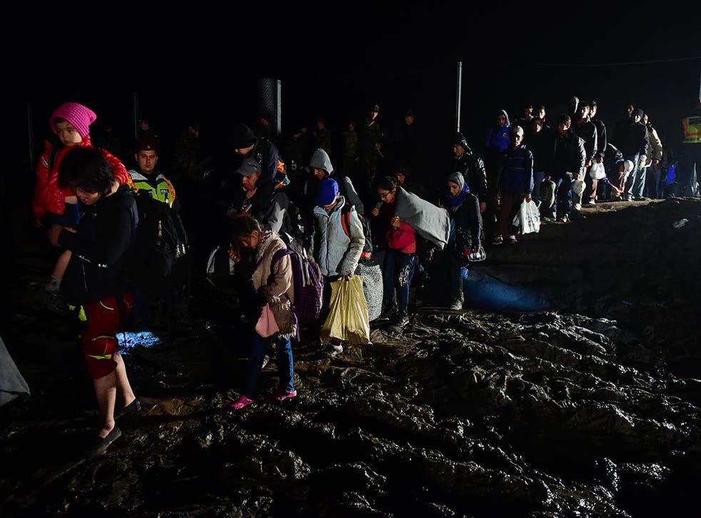 A group of migrants cross the border before Hungarian soldiers closed the border between Hungary and Croatia in Zakany in October