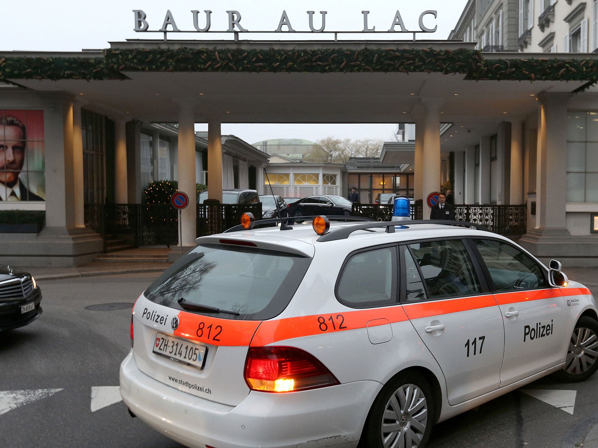 A police car in front of the entrance of the Hotel Baur au Lac in Zurich, where Swiss authorities conducted an early-morning operation to arrest several Fifa football officials on 3 December