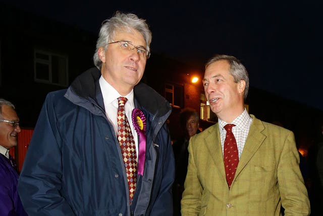 John Bickley, left, Ukip candidate for Oldham West and Royton talks to Ukip Leader Nigel Farage before a visit to a local polling station during the final few hours of voting in the by-election