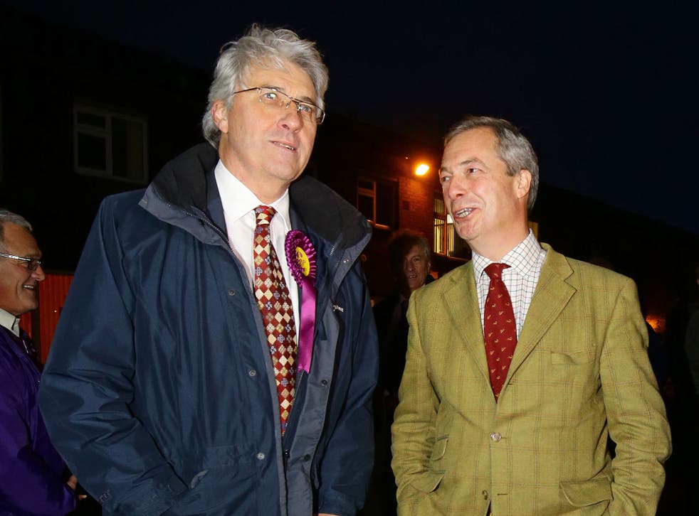 John Bickley, left, Ukip candidate for Oldham West and Royton talks to Ukip Leader Nigel Farage before a visit to a local polling station during the final few hours of voting in the by-election