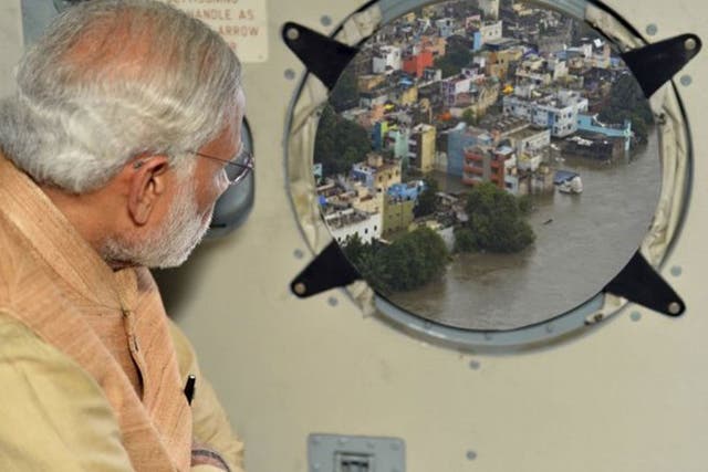 This photo of Narendra Modi viewing flood damage in Chennai, published on a government website, has raised eyebrows