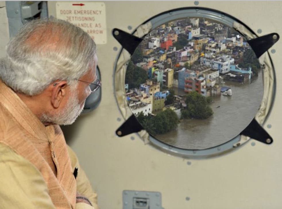 This photo of Narendra Modi viewing flood damage in Chennai, published on a government website, has raised eyebrows