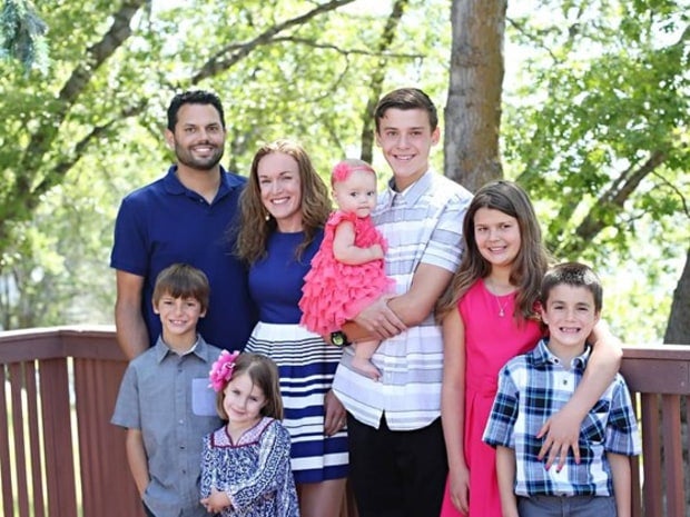 Michael Raymond Wetzel, left, poses with his family.