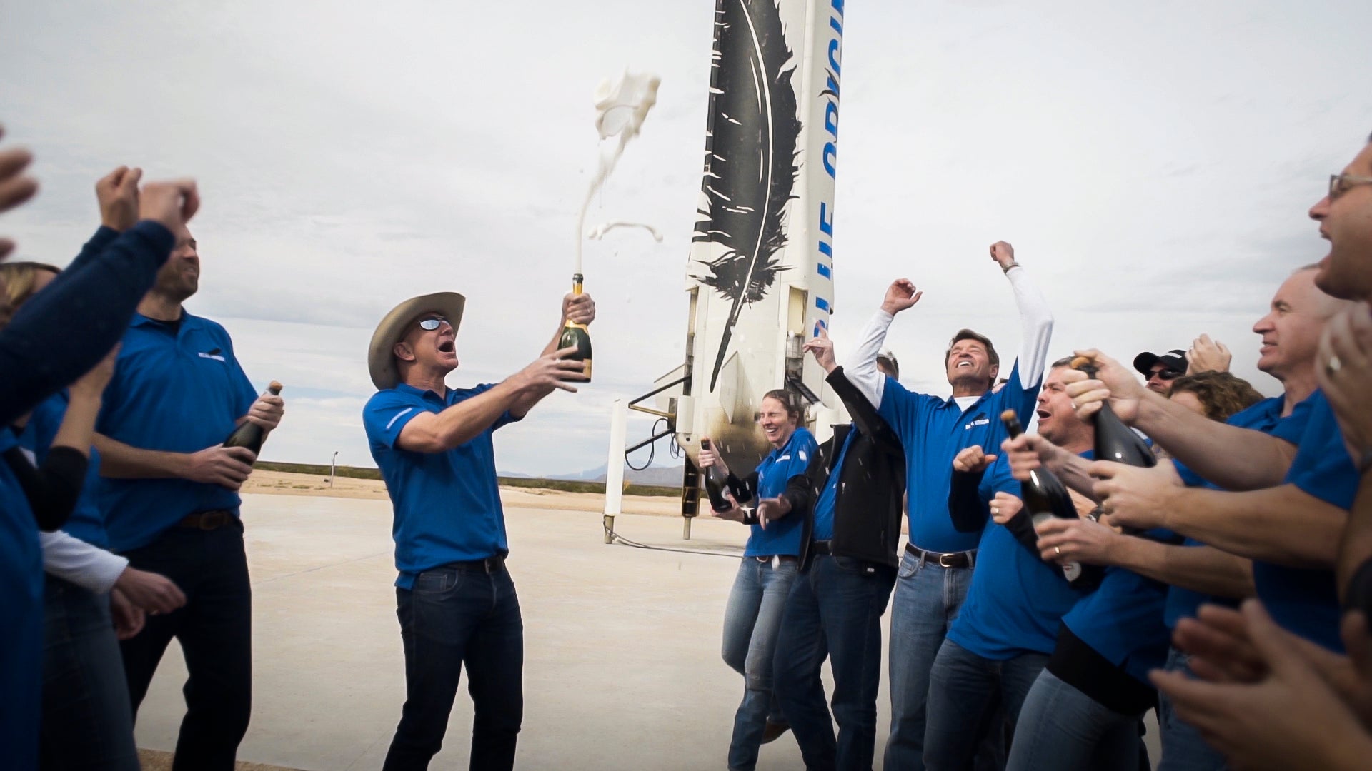 Blue Origin staff celebrate at the New Shepard landing site