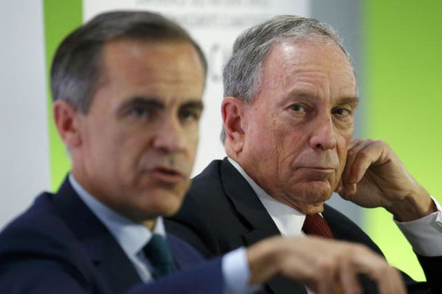 Bank of England governor Mark Carney (L) and former New York City Mayor Michael Bloomberg attend a meeting during the World Climate Change Conference 2015