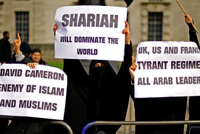 Muslim women demonstrate in favour of Sharia law during a protest outside 10 Downing Street in 2011