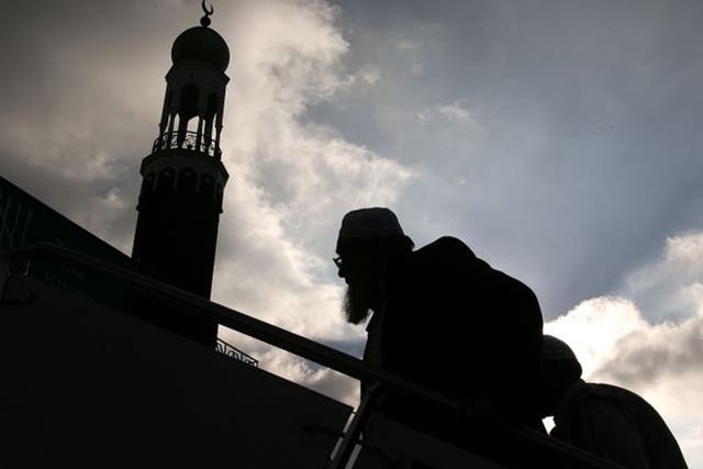 Muslims arrive for Friday prayers at Birmingham Central Mosque, where one of Britain’s sharia courts is located