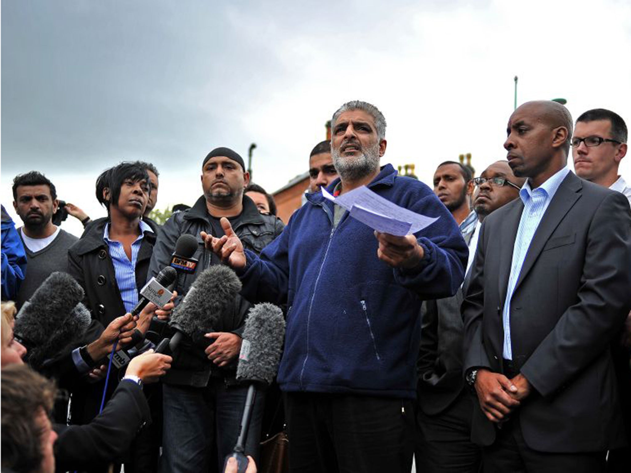 Tariq Jahan, father of Haroon Jahan, gives a statement to the media near the crime scene where Haroon and two other Asian men were hit by a car and killed