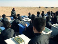 Isis using schools to 'brainwash children and train them with weapons'