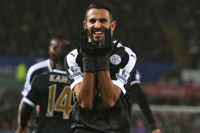 Riyad Mahrez celebrates his hat-trick for Leicester against Swansea