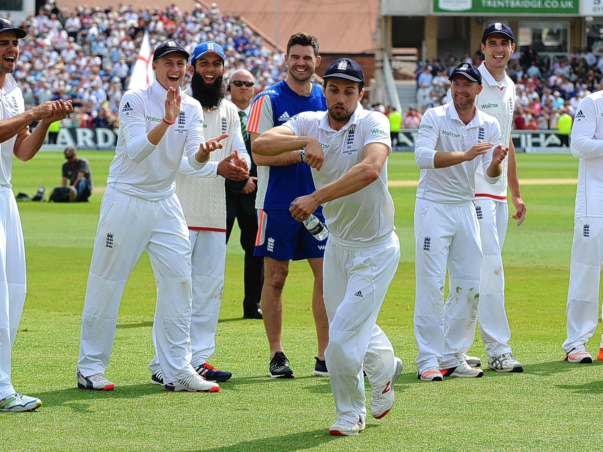 Mark Wood performs his imaginary horse act, to the delight of his team-mates