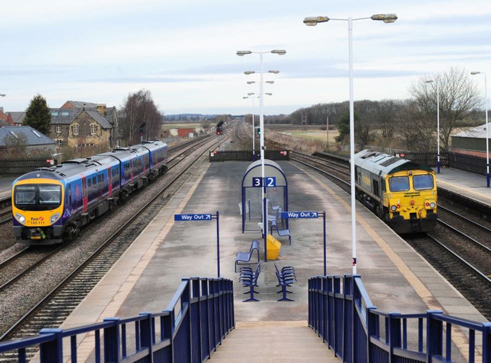 Two trains pass through Church Fenton, North Yorkshire where it is proposed the HS2 railway will link with the East Coast Mainline