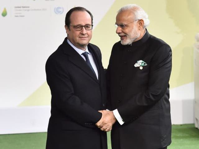 François Hollande of France welcomes Narendra Modi of India on Monday