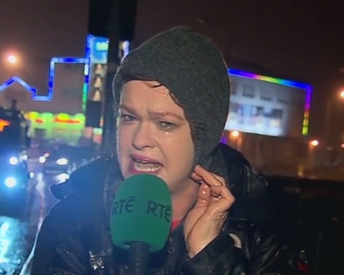 TV presenter Teresa Mannion braces herself in the middle of Storm Desmond