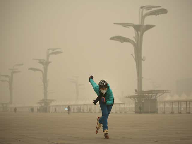 A rollerblader dons a mask to practise at Beijing’s Olympic Park