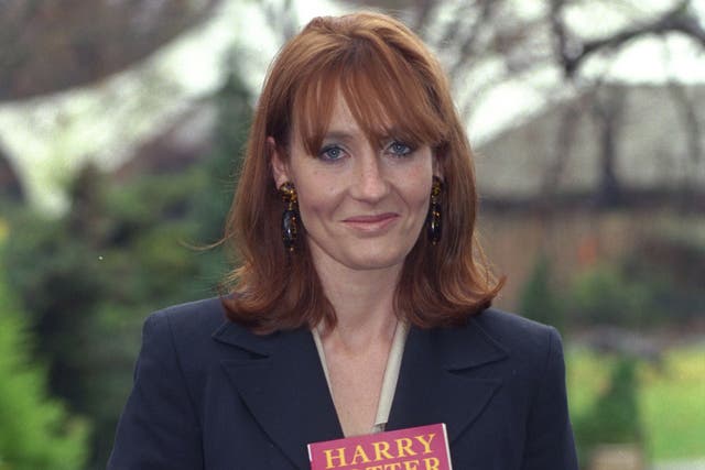 JK Rowling with her first Harry Potter book in 1997