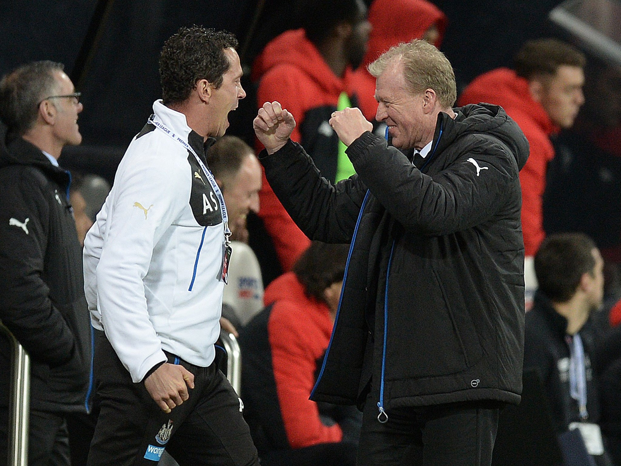 The Newcastle coach, Steve McClaren, right, celebrates after their second goal wrapped up victory