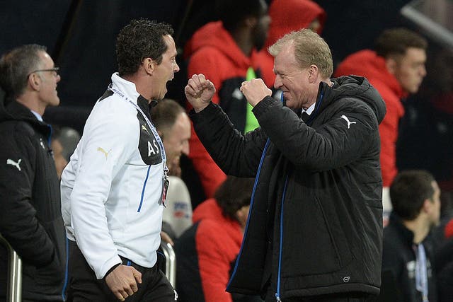 The Newcastle coach, Steve McClaren, right, celebrates after their second goal wrapped up victory