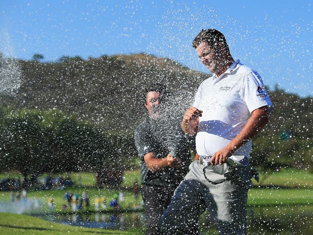Marc Leishman is sprayed with champagne after winning the Nedbank Golf Challenge by six shots