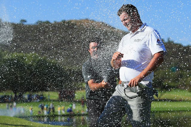 Marc Leishman is sprayed with champagne after winning the Nedbank Golf Challenge by six shots