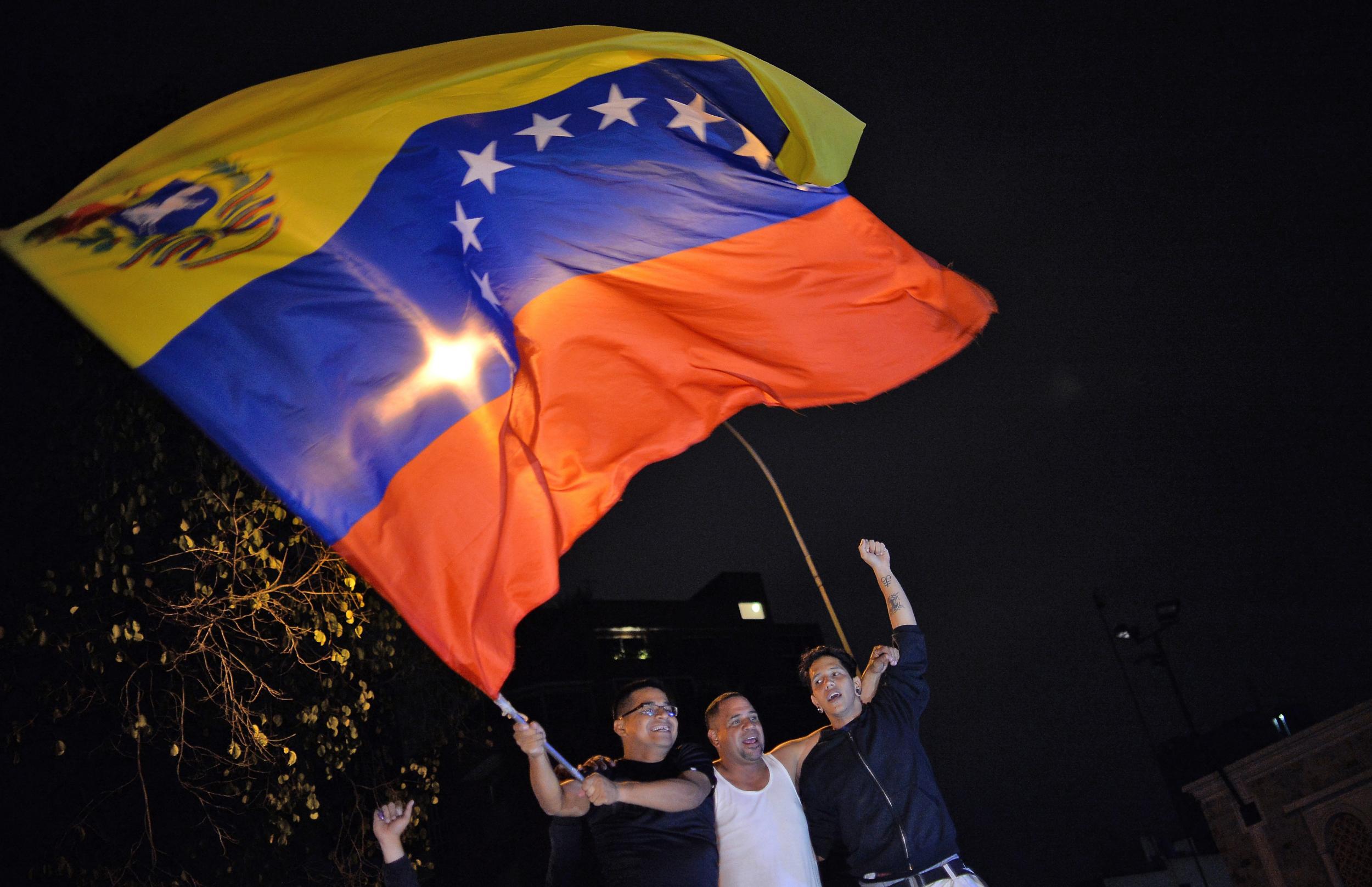 Venezuelan opposition supporters celebrate the results of the legislative election in Caracas