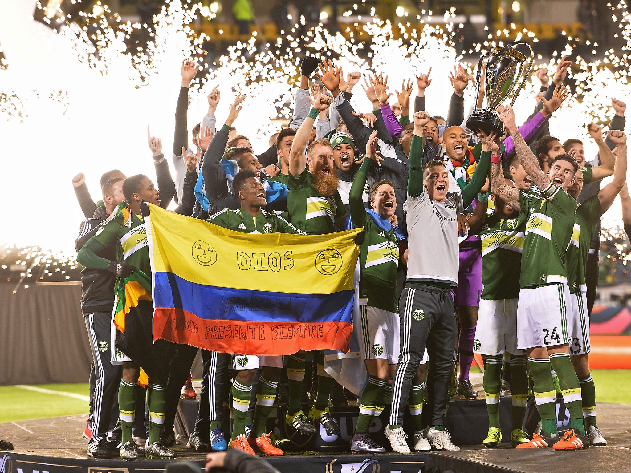 Liam Ridgewell lifts the MLS Cup after the Portland Timbers beat Columbus Crew