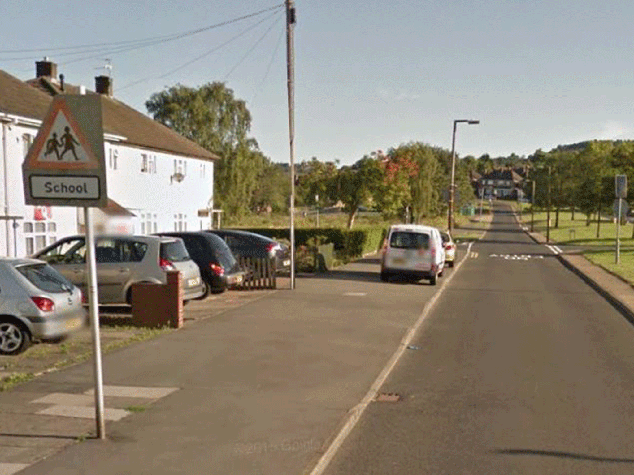 The 13-year-old girl was in Harvest Road in Rowley Regis at around 8.15am when the man approached her