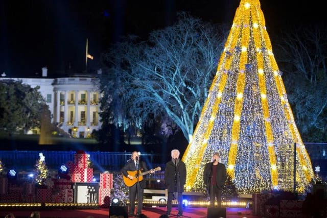 Members of Crosby, Stills and Nash perform on stage during the National Christmas Tree Lighting ceremony at the Ellipse in Washington