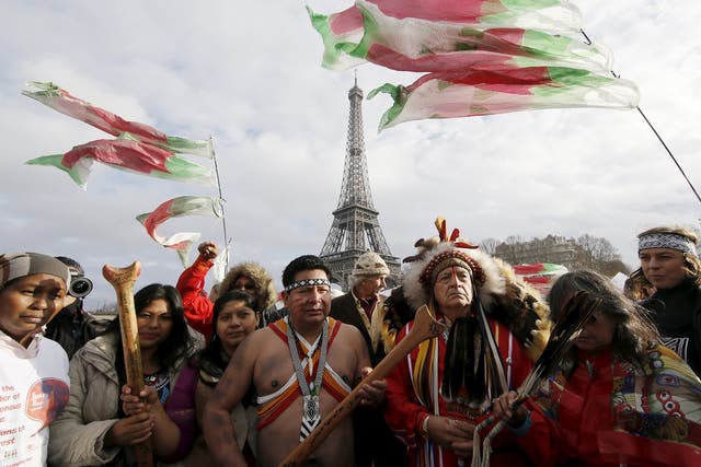 Protesters in Paris call for faster action from world governments over climate change.