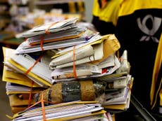 Tonne of undelivered letters and parcels found in postman’s basement