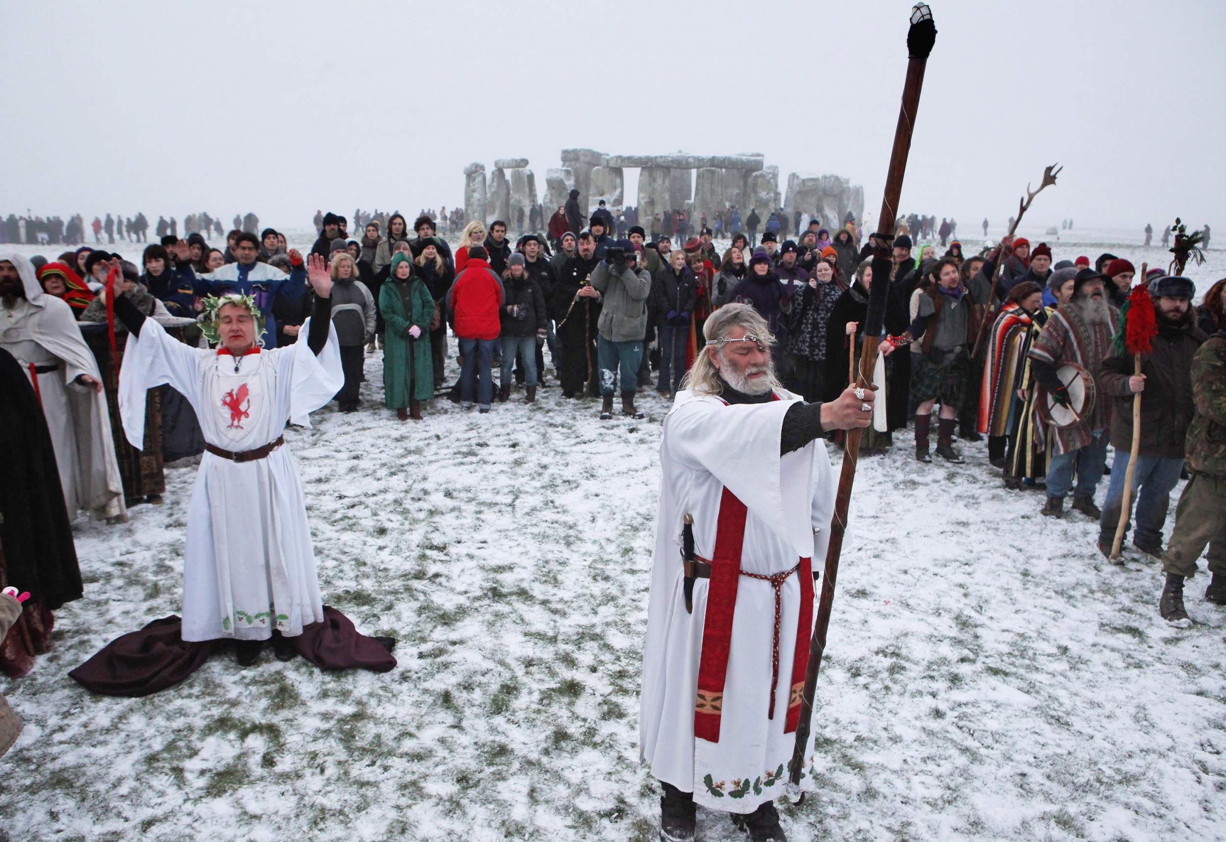 A druid welcomes in the winter solstice at Stonehenge