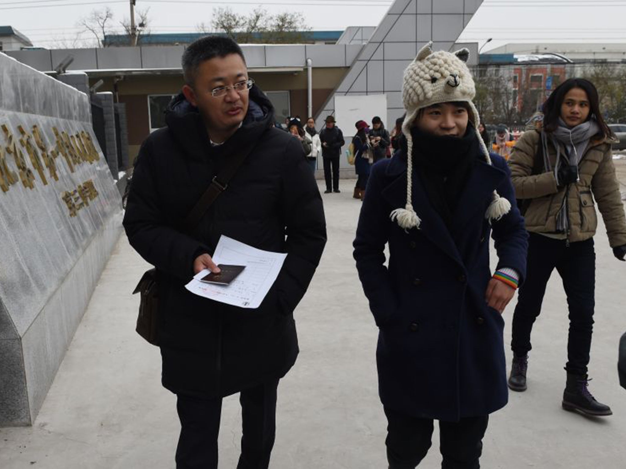 Qiu Bai, right,and her lawyer, Wang Zhenyu, at Beijing People’s Court