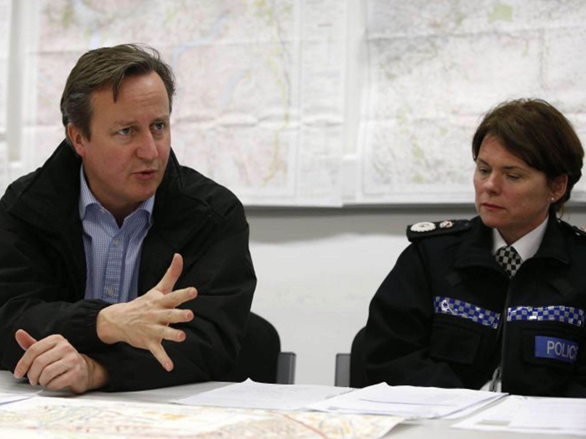 Prime Minister David Cameron attends a meeting of flood rescue services at police headquarters in Carlisle