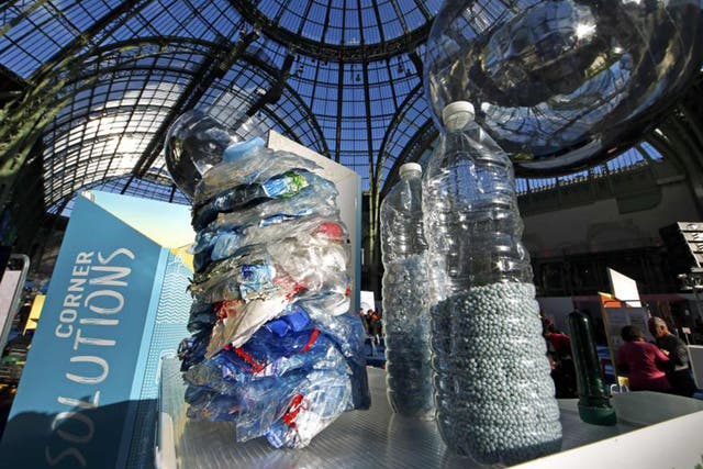 Recycled plastic bottles pictured at the Grand Palais during the Solutions COP21 in Paris, France. Global leaders have until Friday night to finalise a strong deal on combating climate change