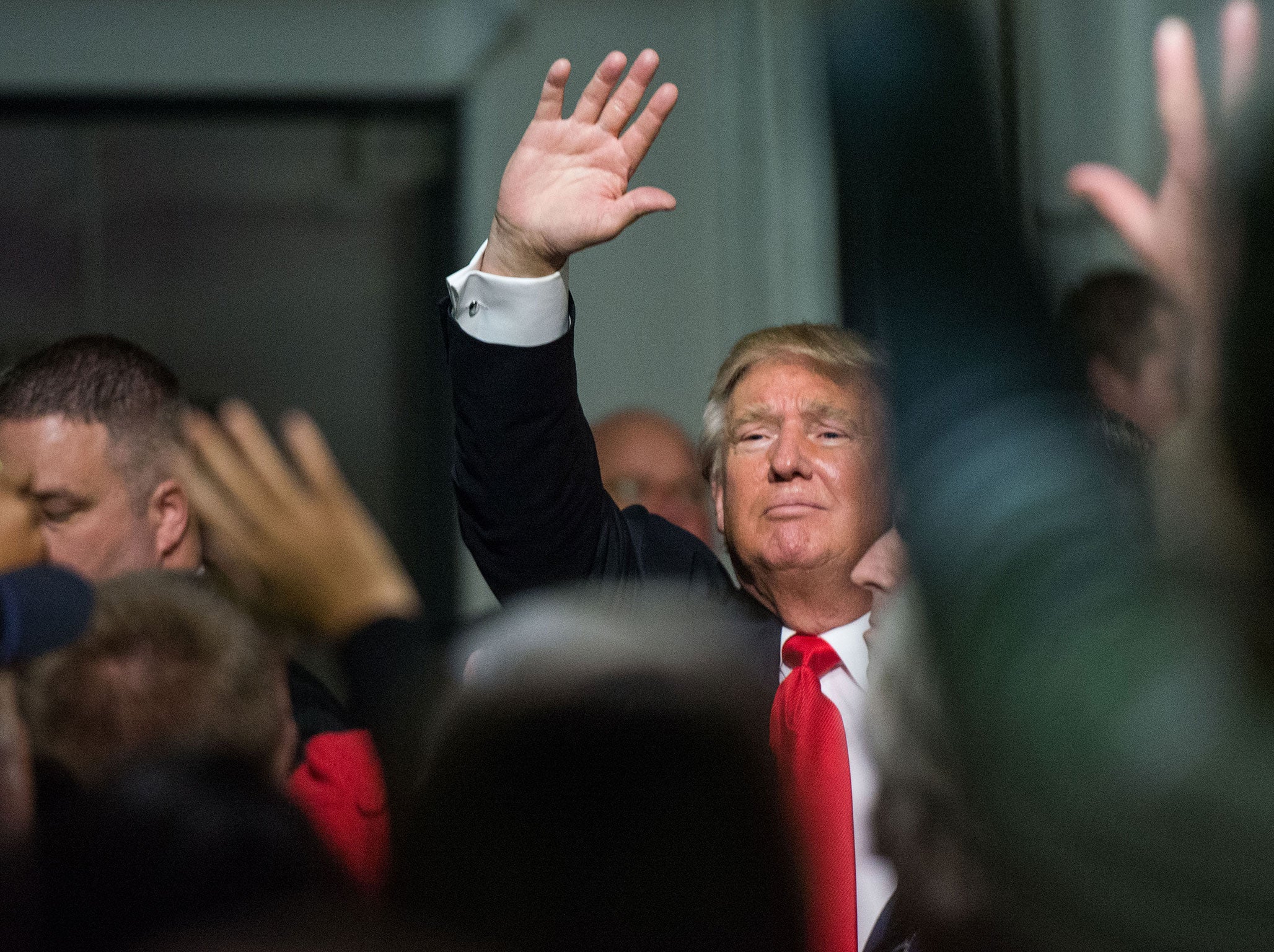 Republican presidential candidate Donald Trump waves to the crowd at a Pearl Harbor Day Rally at the U.S.S. Yorktown December 7, 2015 in Mt. Pleasant, South Carolina. The South Carolina Republican primary is scheduled for February 20, 2016