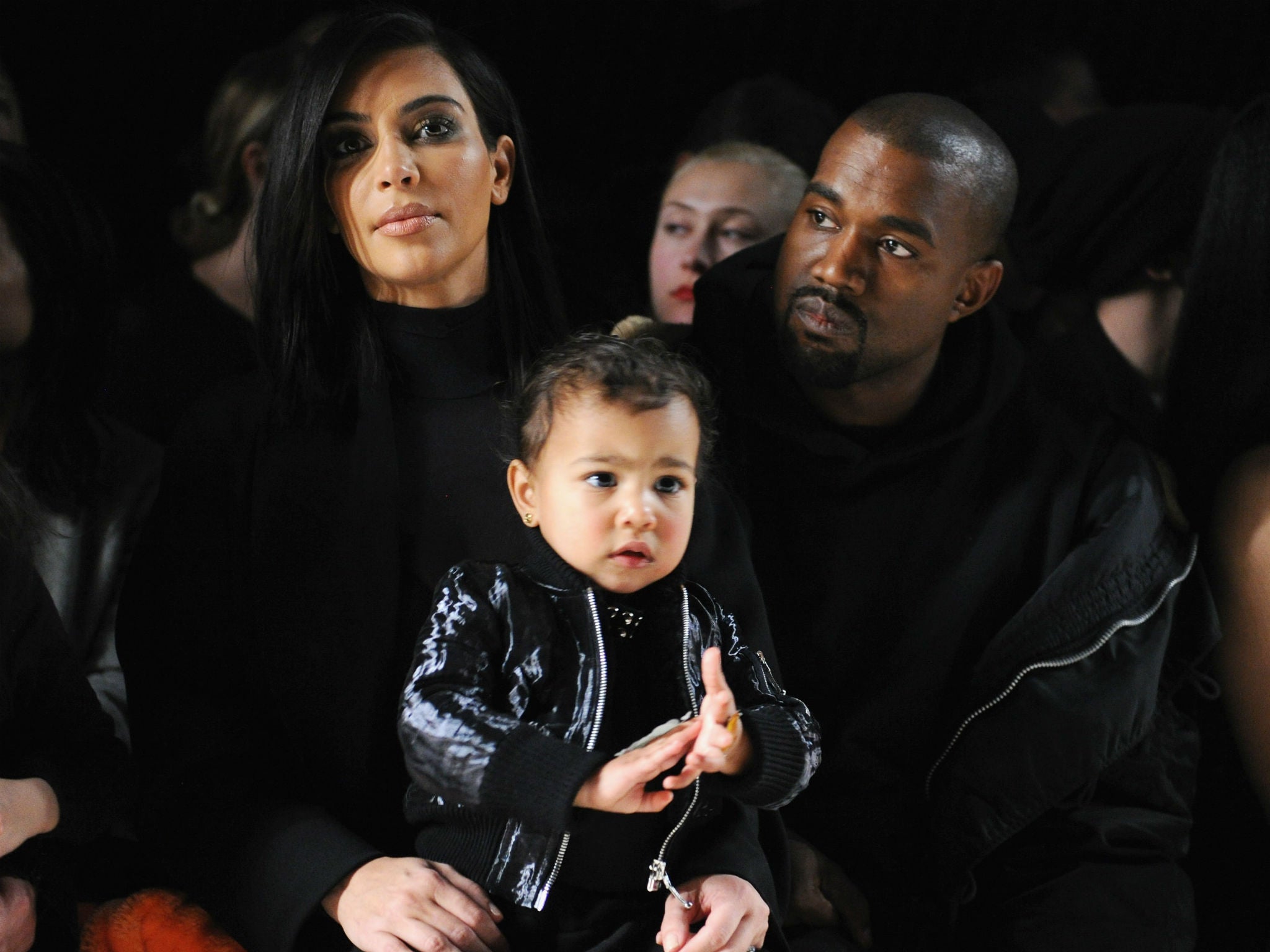 Saint is the newest addition to the family who are pictured watching the Alexander Wang NYFW show in February