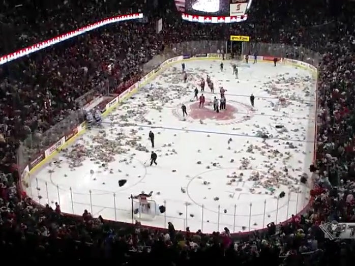 Watch the moment ice hockey fans threw 28,000 teddy bears ...