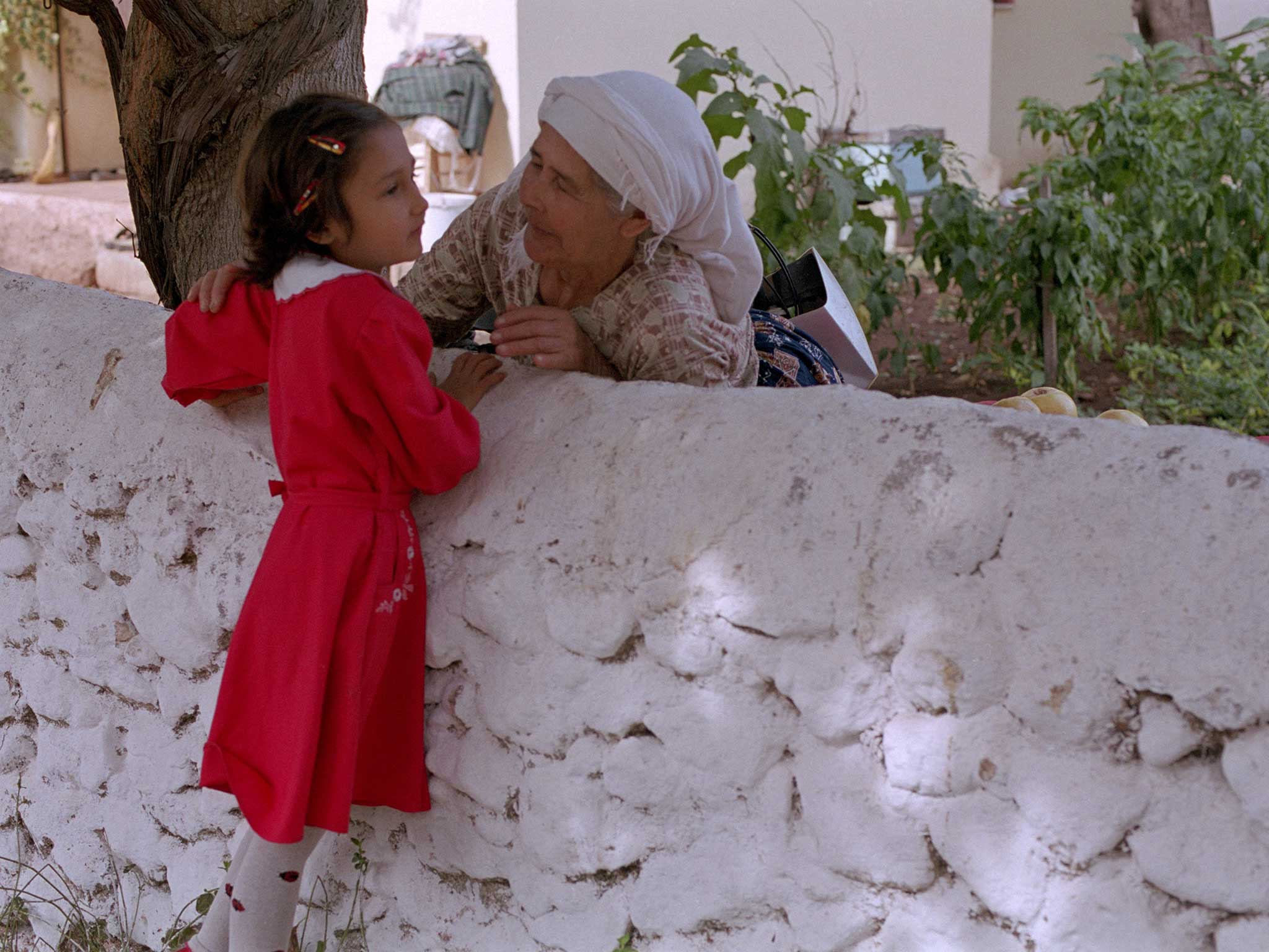 A Turkish girl greets her grandmother