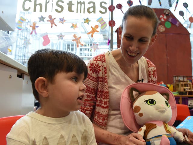 Specialist play worker Lynsey Steele prepares four-year-old Jake Morgan for his kidney transplant
