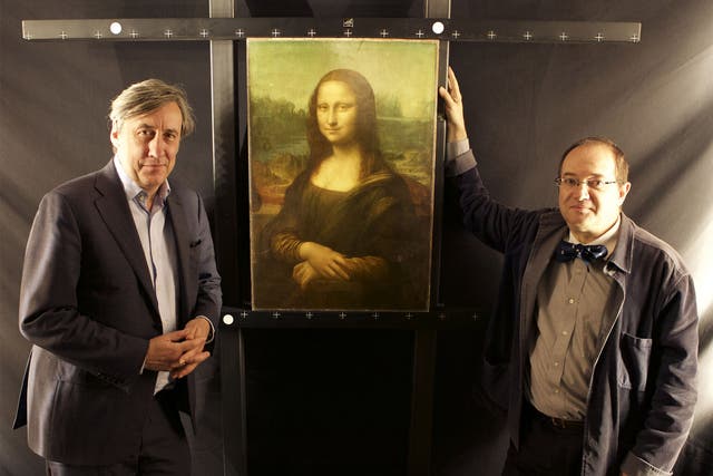 Pascal Cotte, right, and Andrew Graham-Dixon, with The Mona Lisa