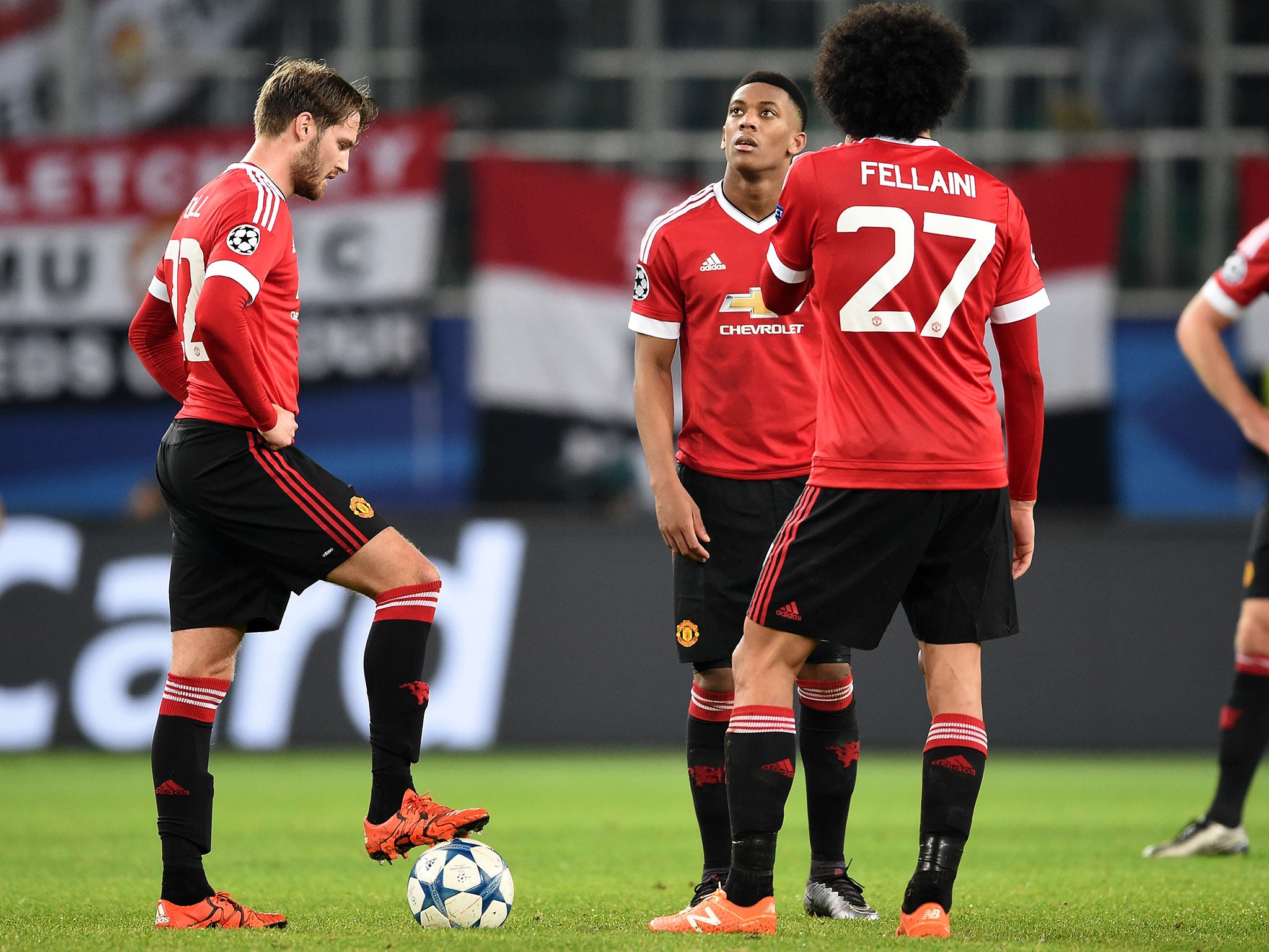 Manchester United players, in their current kit, react to the defeat by Wolfsburg on Tuesday