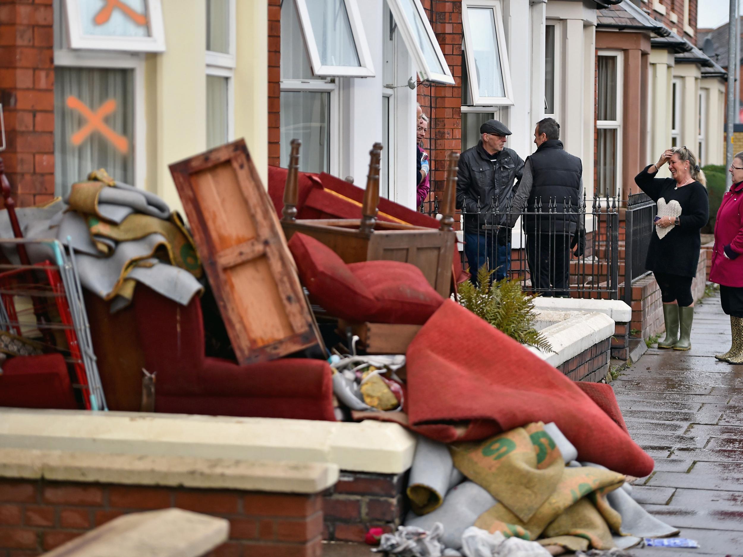 Residents start to empty their possessions from their homes after Storm Desmond caused flooding