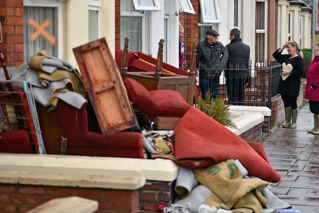 Residents start to empty their possessions from their homes after Storm Desmond caused flooding