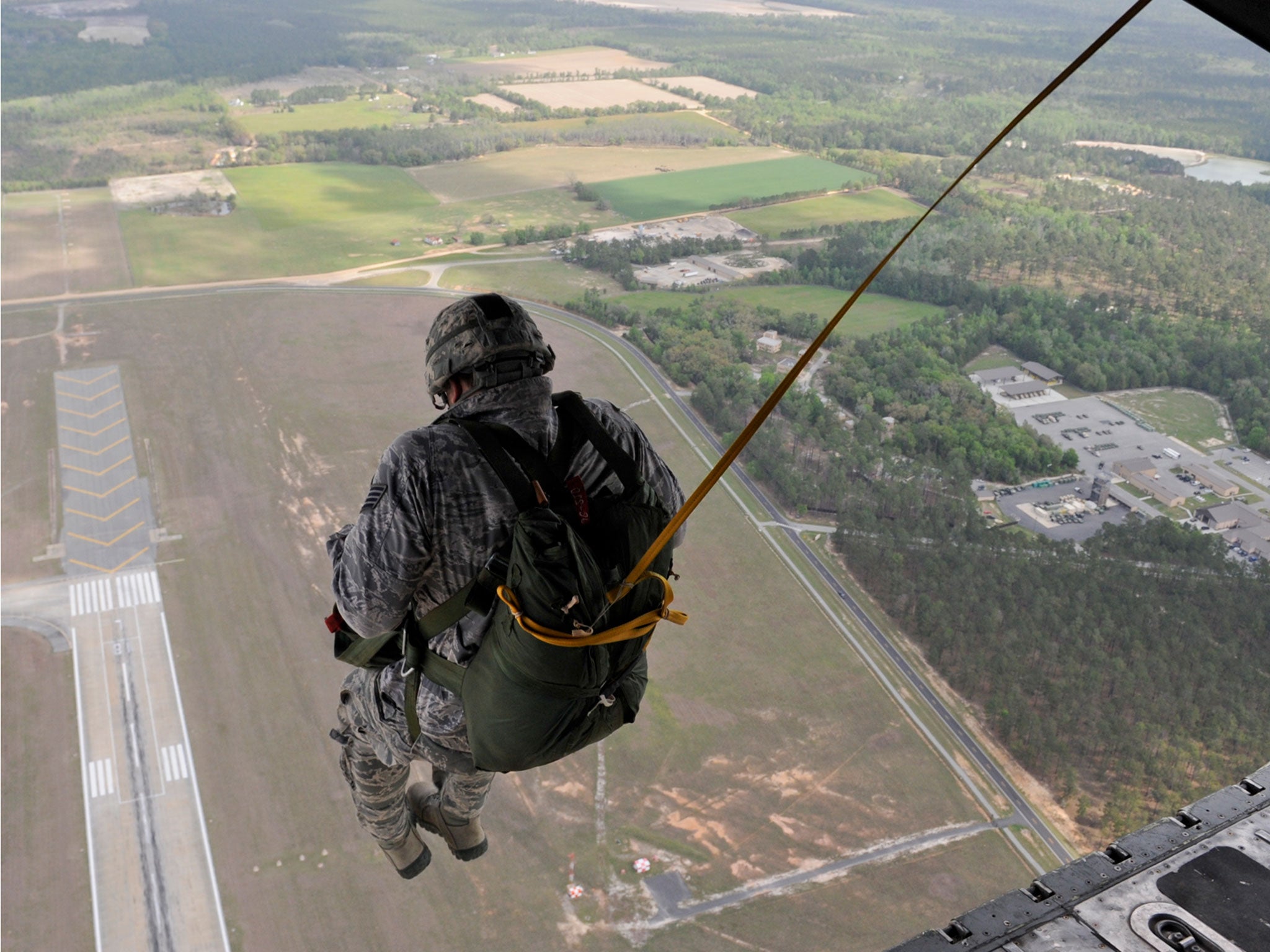 A US Air Force parachutist jumps out of a plane above Moody Air Force Base