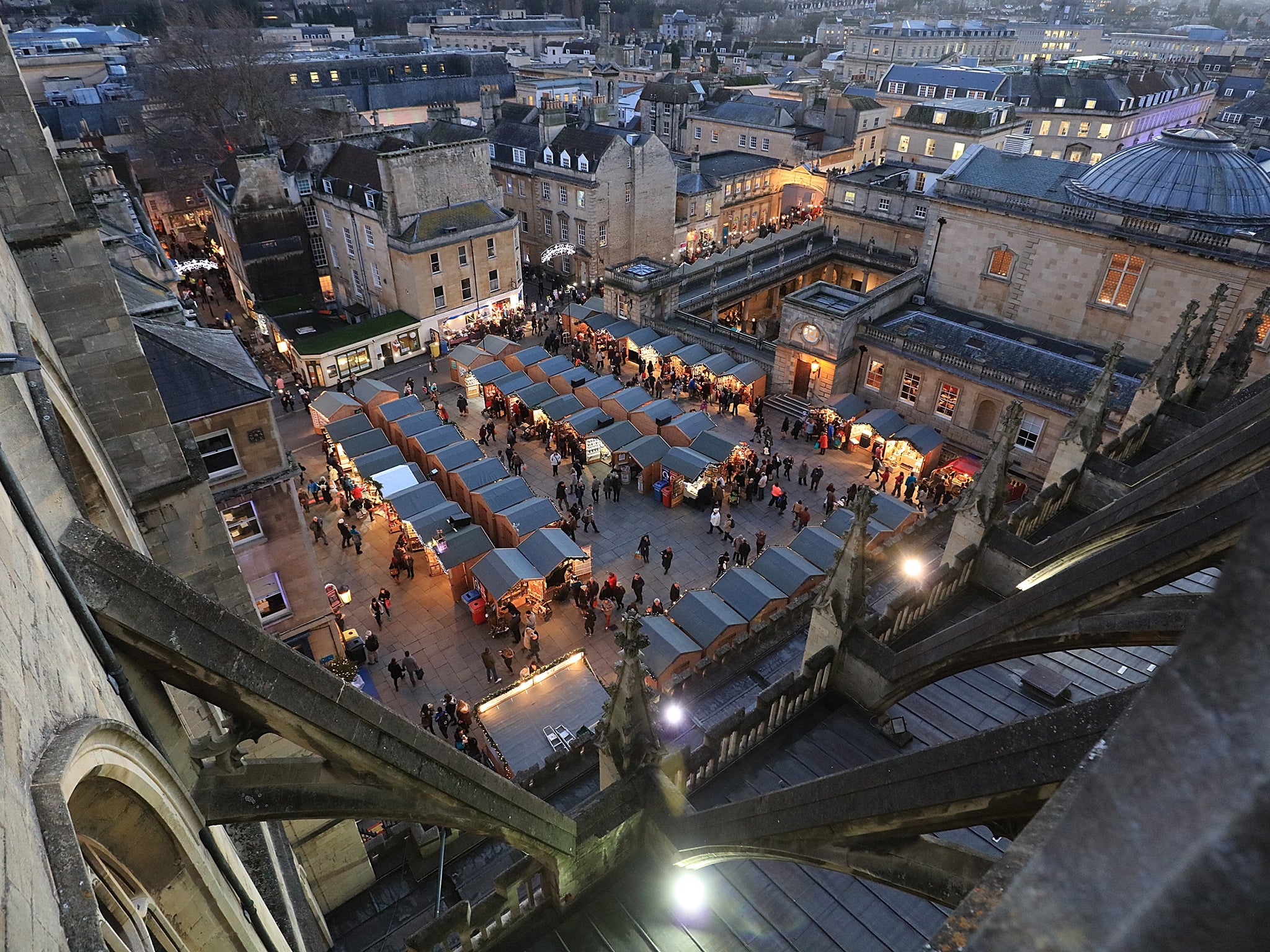The award-winning Bath Christmas Market in the centre of the city as seen from the Abbey