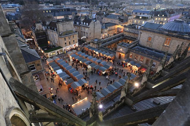 The award-winning Bath Christmas Market in the centre of the city as seen from the Abbey