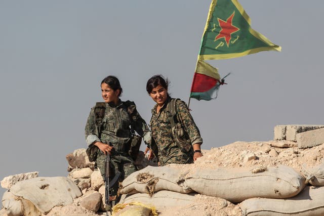 Kurdish People's Protection Units at a checkpoint in the outskirts of Ain al-Arab in 2015