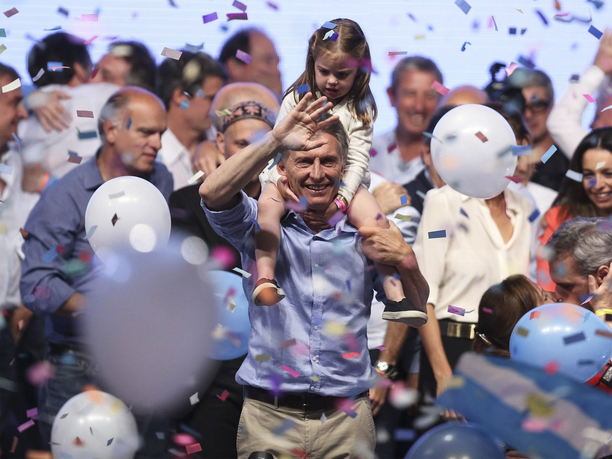 Mauricio Macri celebrates winning last month's election